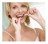 Flossing technique — floss wrapped around the middle fingers
